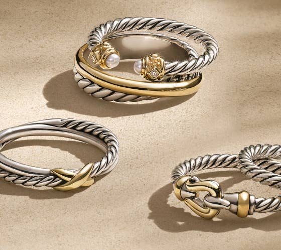 A collection of 6 David Yurman cable rings.