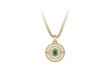 shop evil eye amulet in 18K yellow gold with emeralds and diamonds.