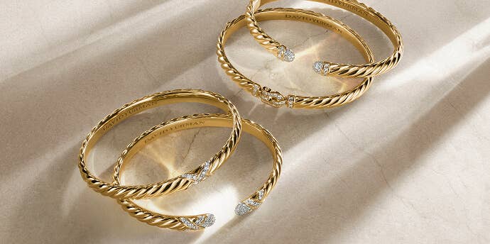 Four David Yurman bracelets for women.