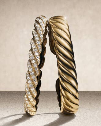 Two David Yurman Sculpted Cable Bracelets.