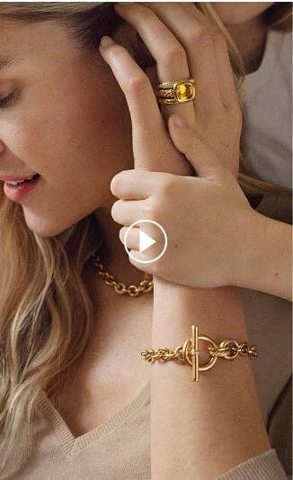 A mother wearing David Yurman jewelry.