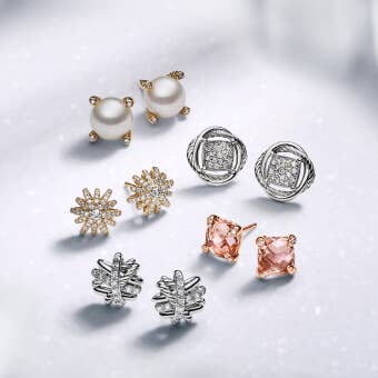 A selection of David Yurman stud earrings featuring stones and pearls.