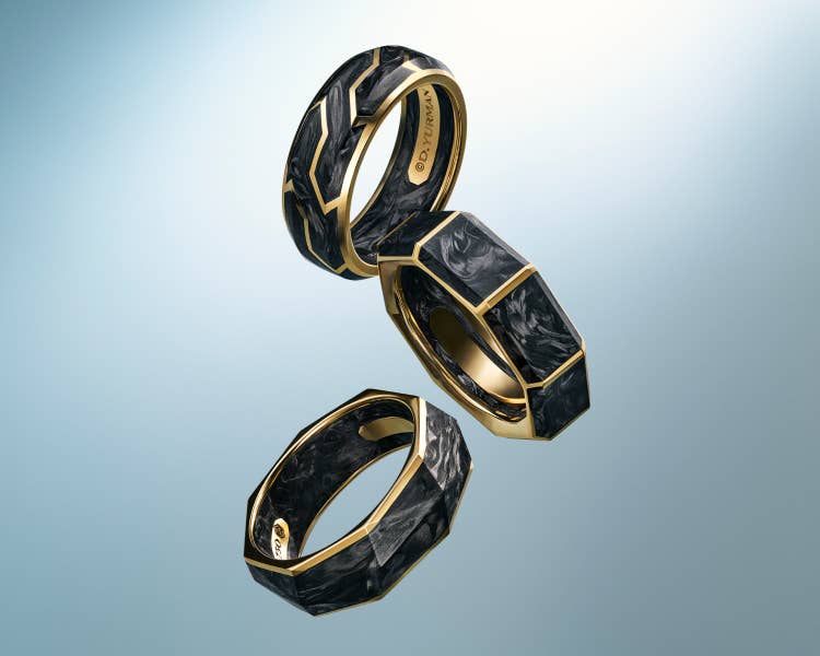 An image of three Forged Carbon band rings.