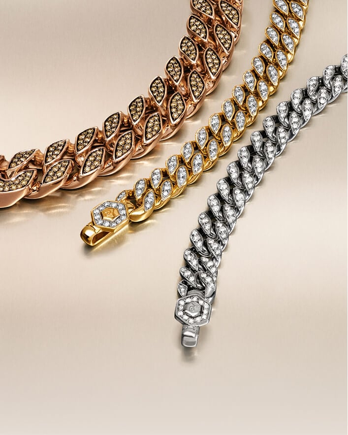 Three David Yurman curb chain necklaces for men.