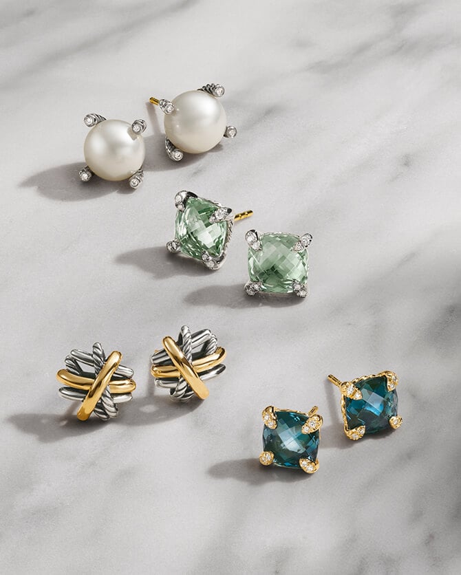 Four pairs of David Yurman stud earrings.