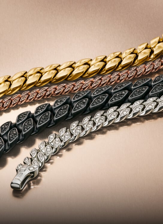 Three David Yurman bracelets for men.