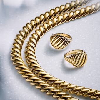 David Yurman Gold Sculpted Cable necklaces and rings.