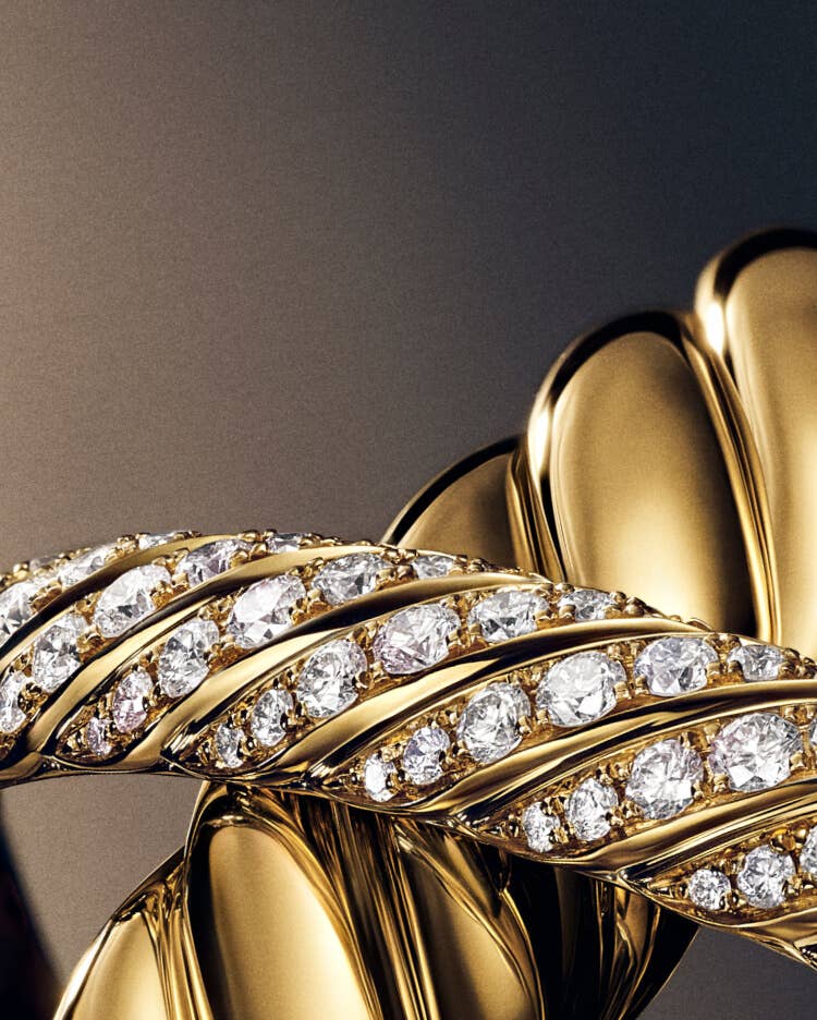 Three David Yurman Sculpted Cable bracelets.
