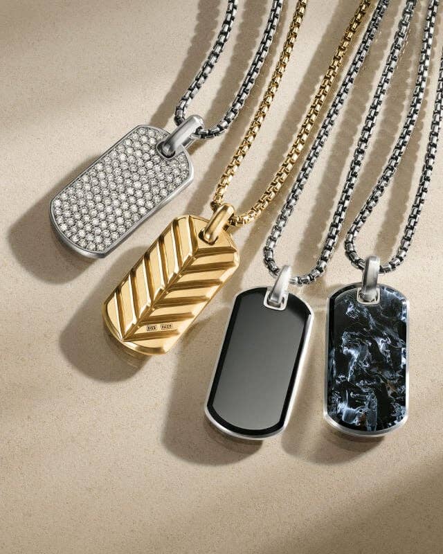 Four David Yurman tags for men.
