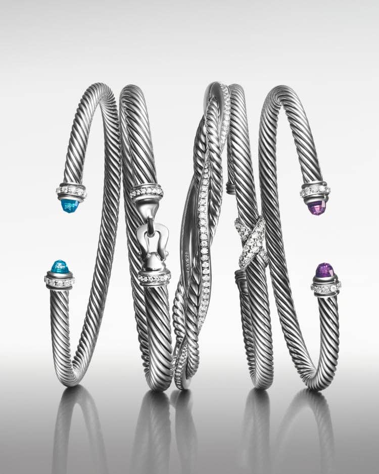 Five David Yurman Cable bracelets in sterling silver.
