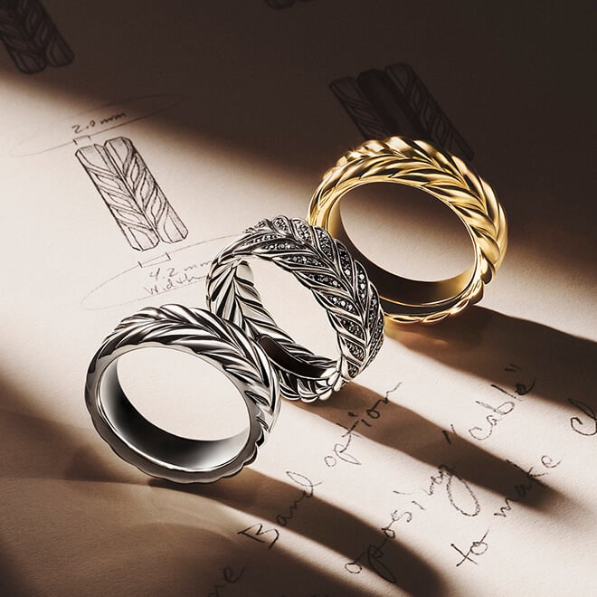 Three David Yurman Sculpted Cable bracelets.