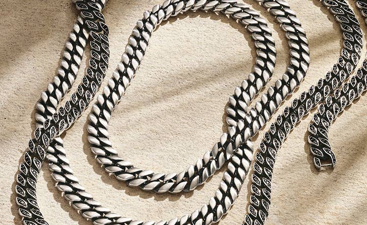 An image of two mens curb chain necklaces.