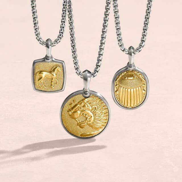Three David Yurman Amulets with mixed metals.