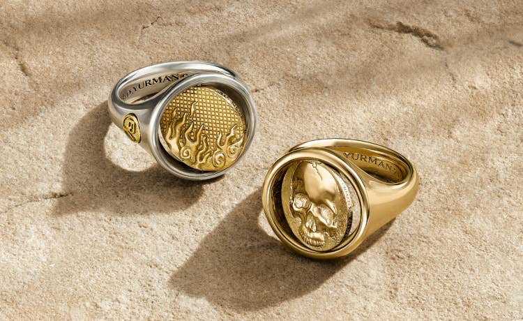 An image of two silver and gold duality rings.