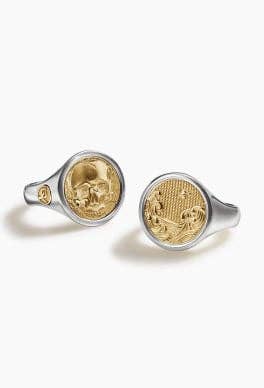 Two David Yurman signet rings in silver and gold.