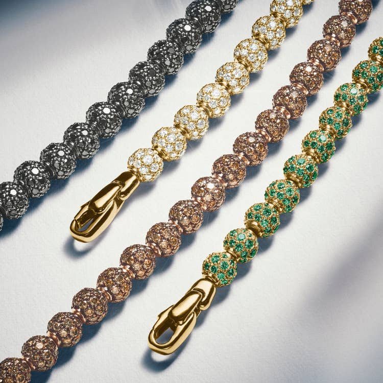 An image of four David Yurman bead necklaces.