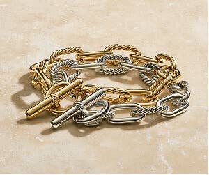 A gold and a silver DY&#174; Madison Toggle Bracelet. 