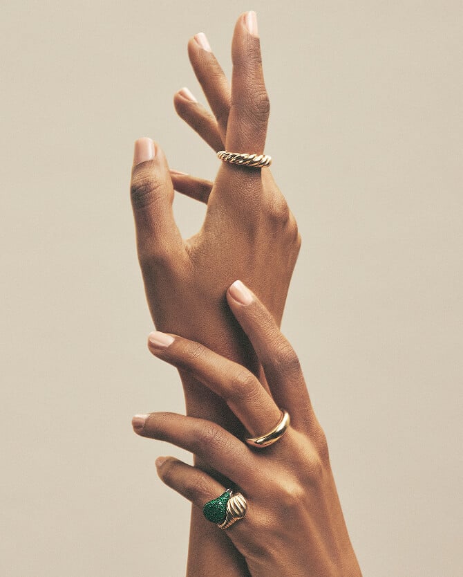 A woman wearing David Yurman rings.