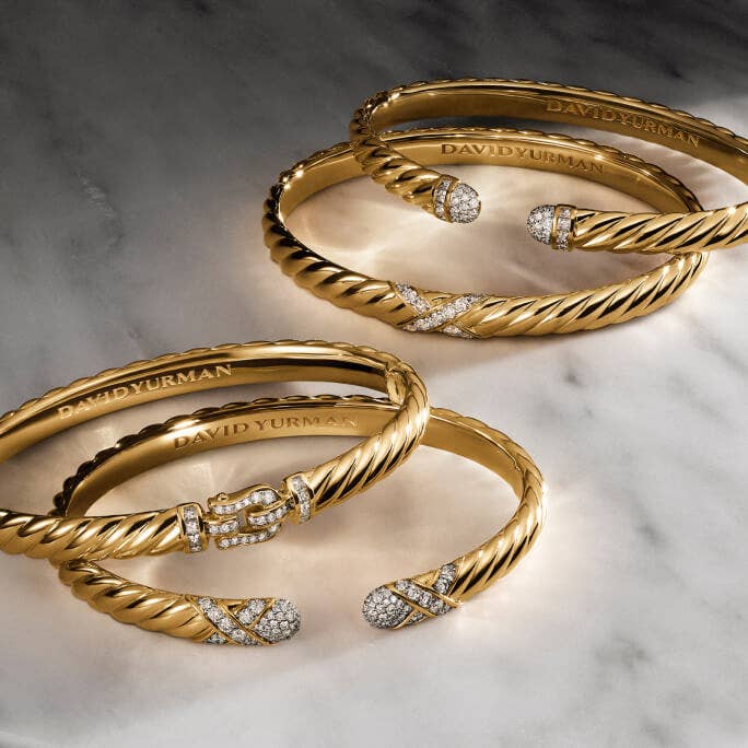 Stack of David Yurman Gold Bracelets