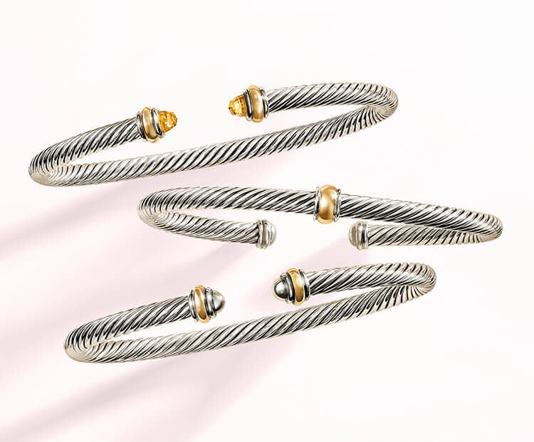 An image of cable bracelets in mixed metals.
