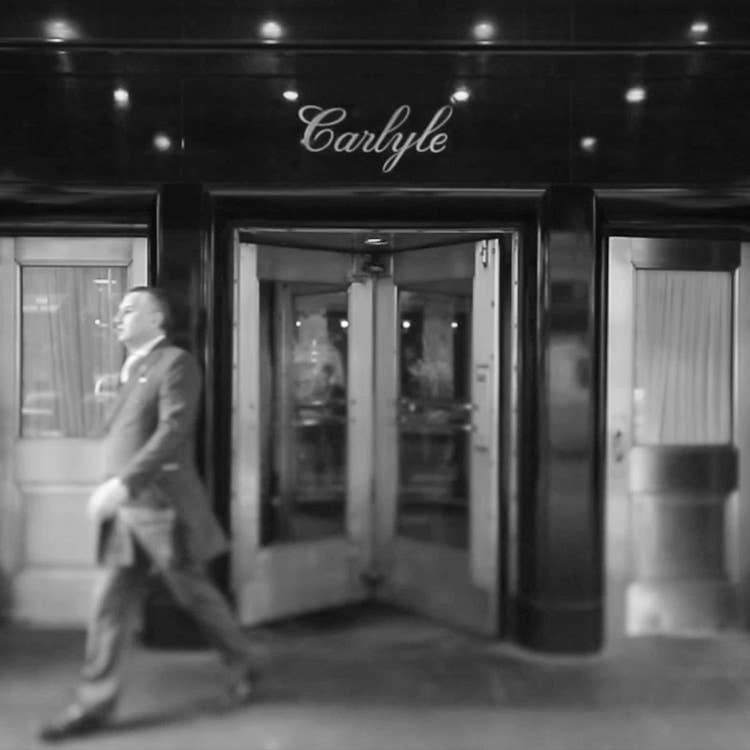 A black and white image of the entrance to the Carlyle hotel