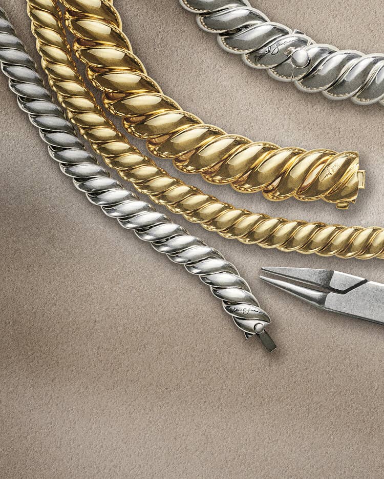 Four David Yurman Sculpted Cable bracelets.