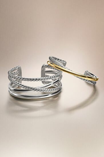 Two David Yurman women's Crossover bracelets.
