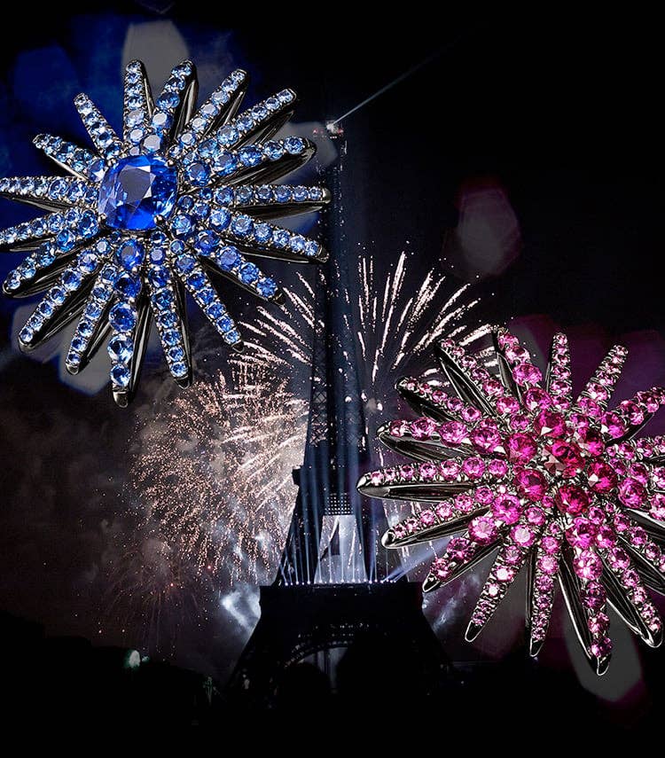 A collage shows fireworks lighting up the Eiffel Tower in between two David Yurman Starburst High Jewelry designs. The jewelry is crafted from 18K white gold and is fully set with blue sapphires, white diamonds, pink sapphires and rubies. On the left of the image is handwritten text that says “So many Starbursts in the world. This is ours!” 