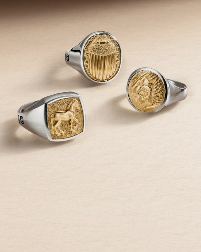 Three David Yurman men's rings.