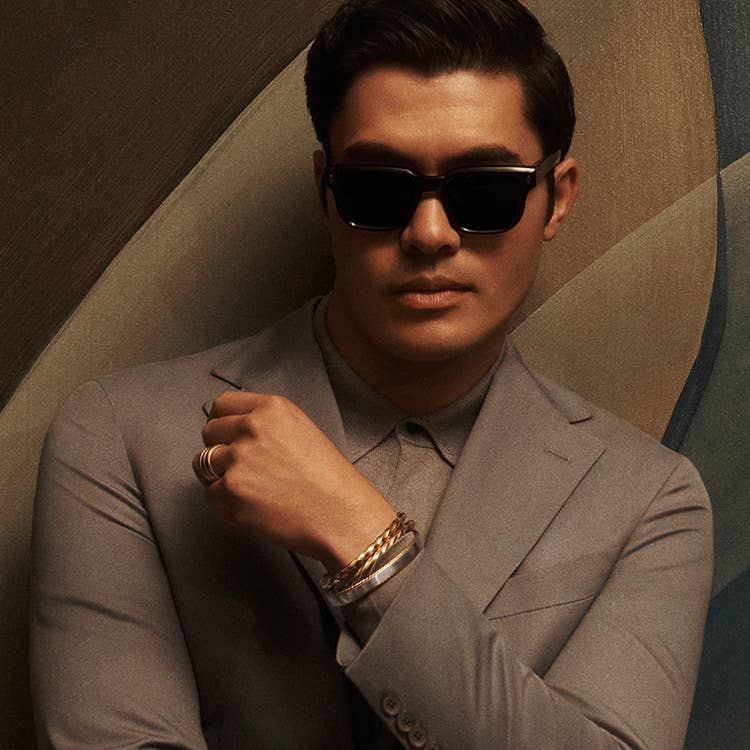 An image of Henry Golding wearing Cable Edge bracelets.
