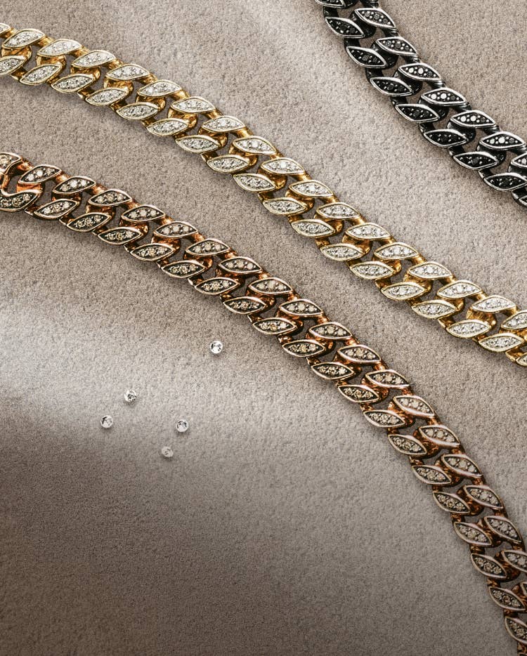 Three David Yurman Curb Chain bracelets.