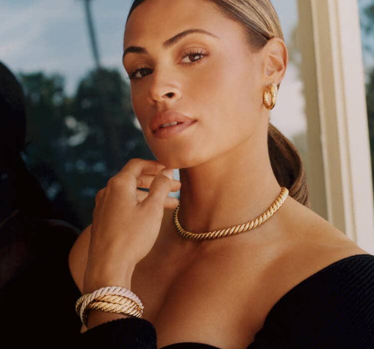 An image of Sydney wearing yellow gold Sculpted Cable.