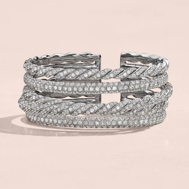 Stack of David Yurman bracelets in White Gold.